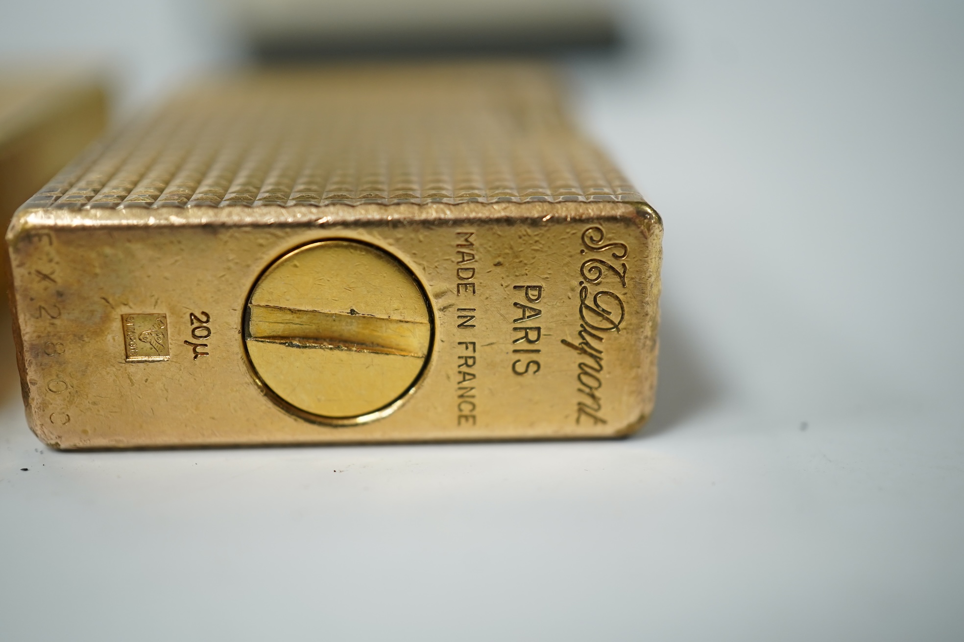 A cased DuPont lighter with booklet and a Dunhill rollagas example